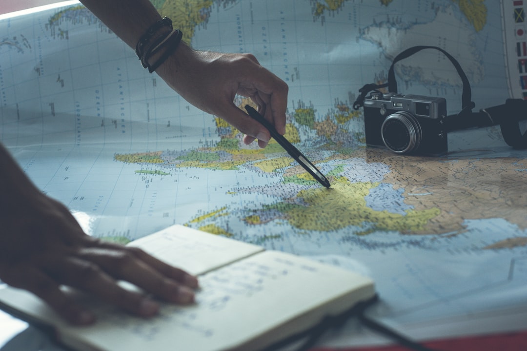 Couple planning their honeymoon trip with a map and budget