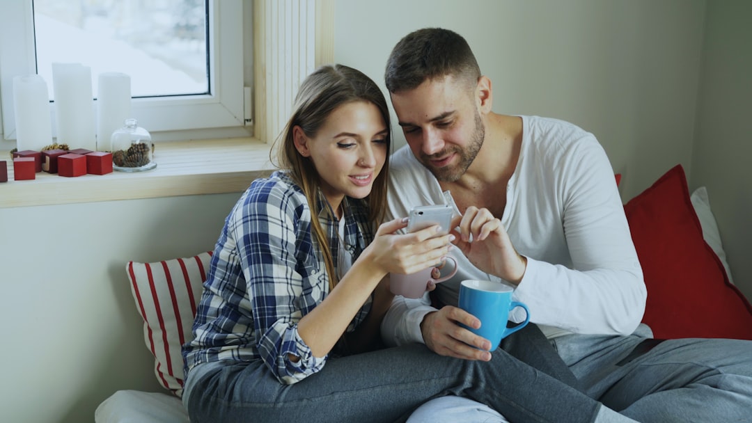 Couple browsing and selecting wedding registry items online
