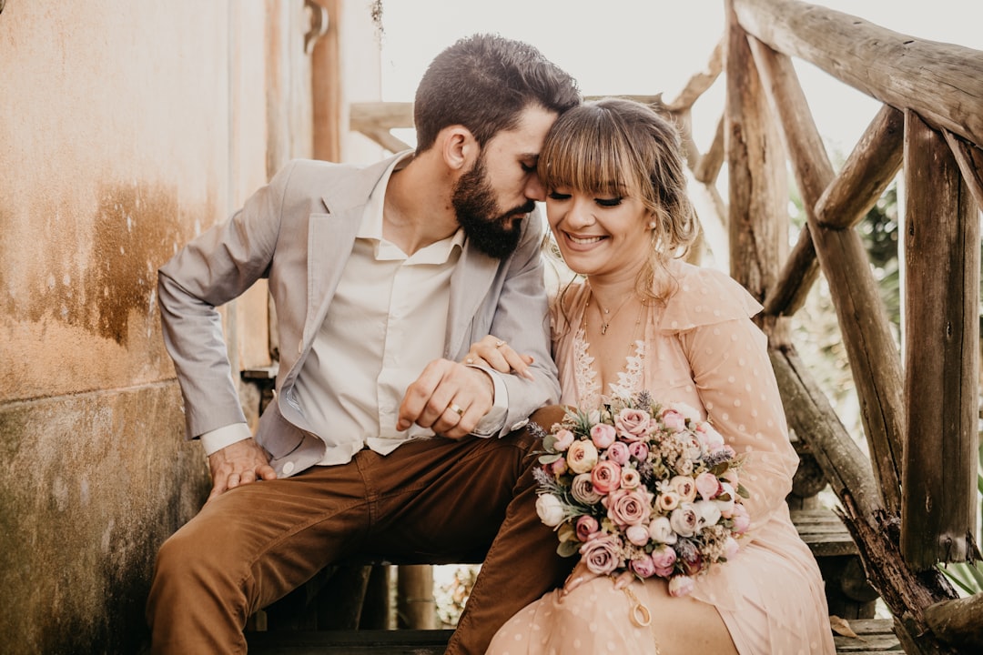 Couple reviewing wedding budget and planning documents
