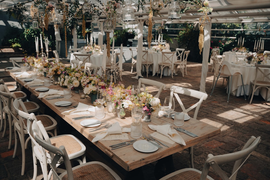 Beautifully set wedding reception dining tables at a venue