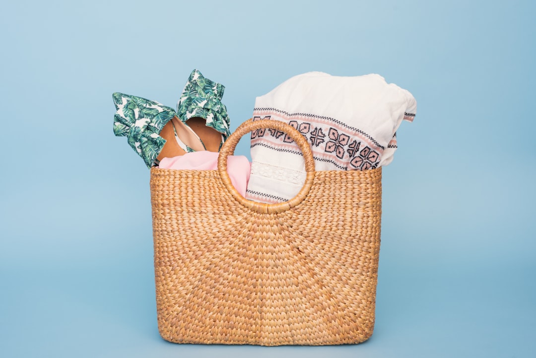 Reef-safe sunscreen and skincare essentials in a beach bag