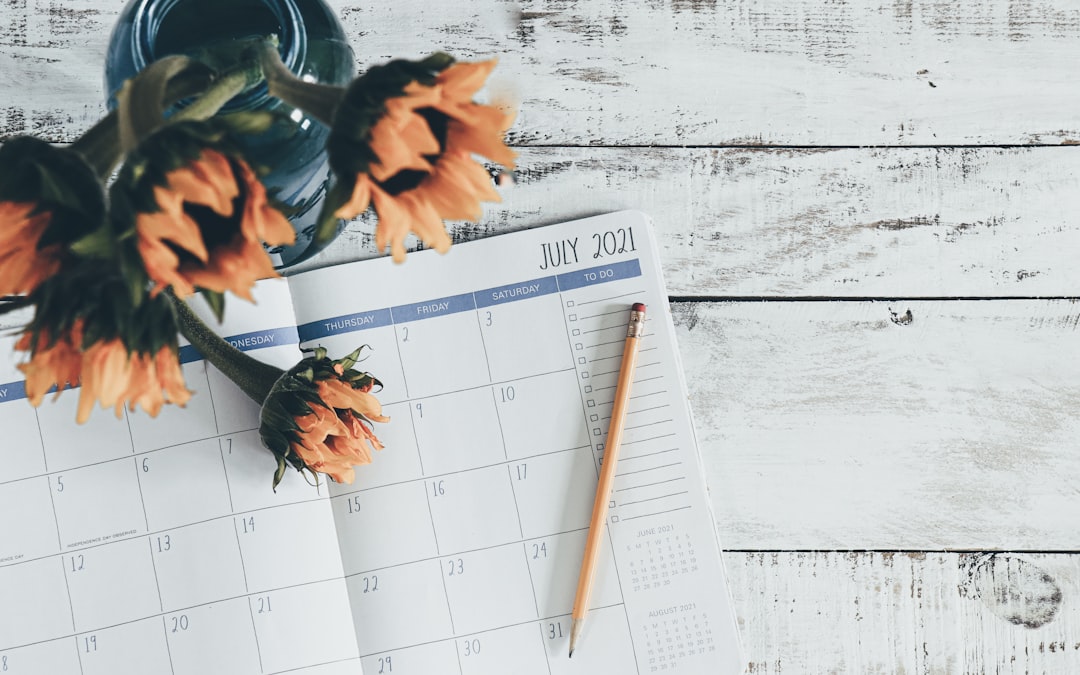 Wedding planning timeline with calendar and checklist on a desk